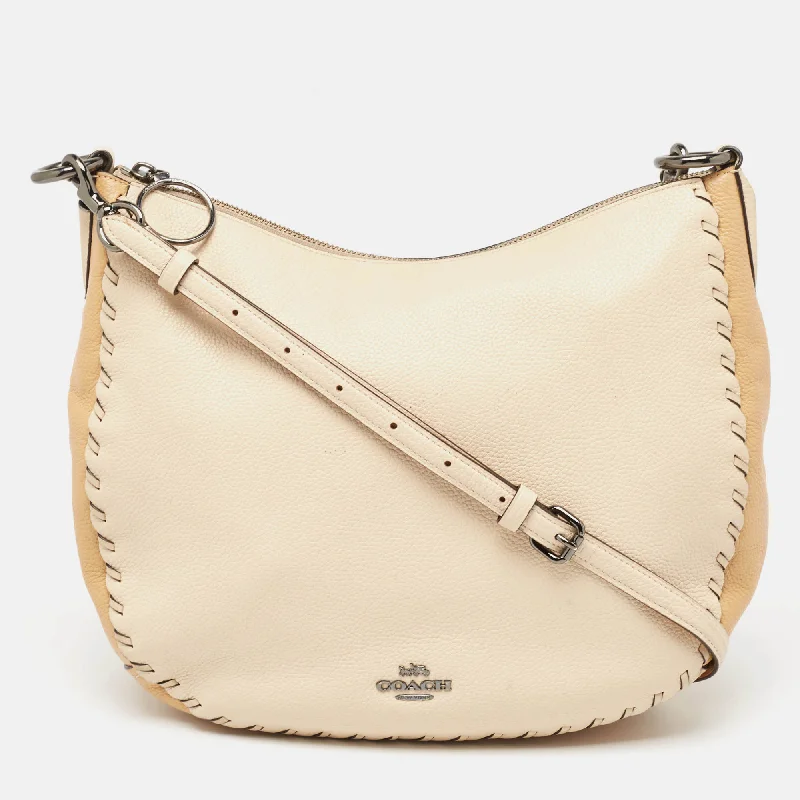 Coach bags with a zippered interior pocket for separating itemsTwo Tone Beige Leather Sutton Hobo