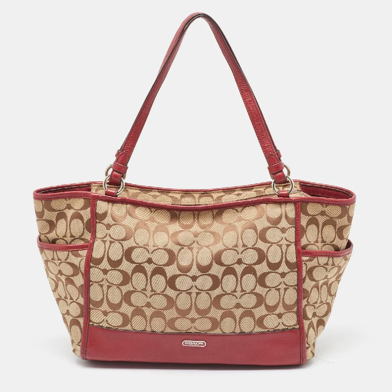 Coach bags with a front - zip pocket for small items like keys and cardsBeige/Burgundy Signature Canvas and Leather Carrie Tote