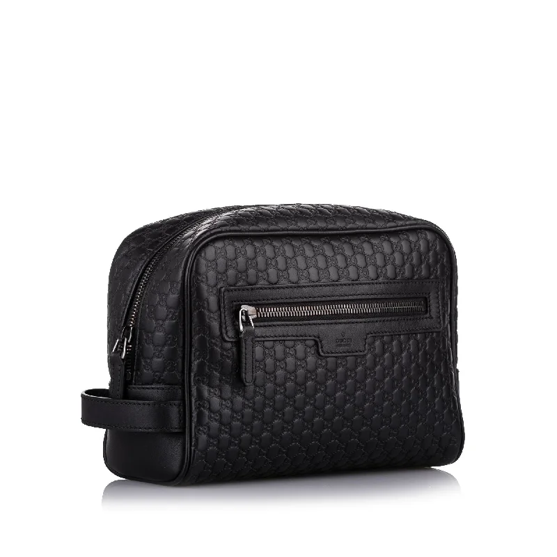 Gucci Marmont bags for women with quilted leather exteriorsGucci Black Microguccissima Clutch