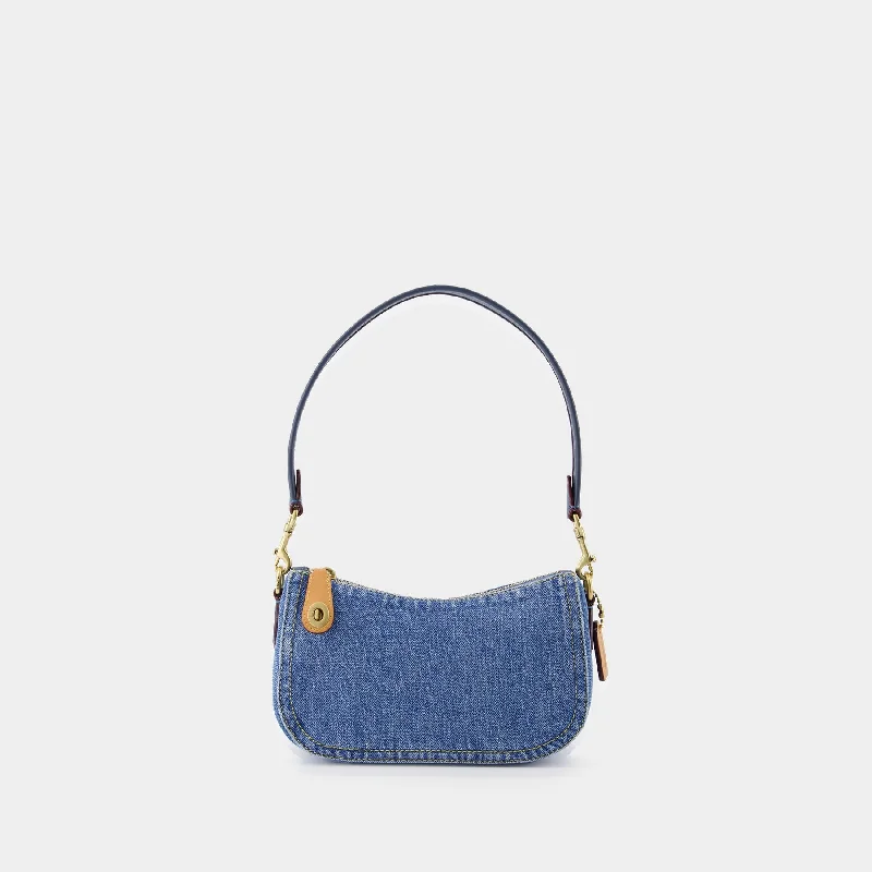 Coach Dempsey bags with a large capacity and a drawstring closureHobo Swinger 20 bag - Coach - Cotton - Denim - Blue