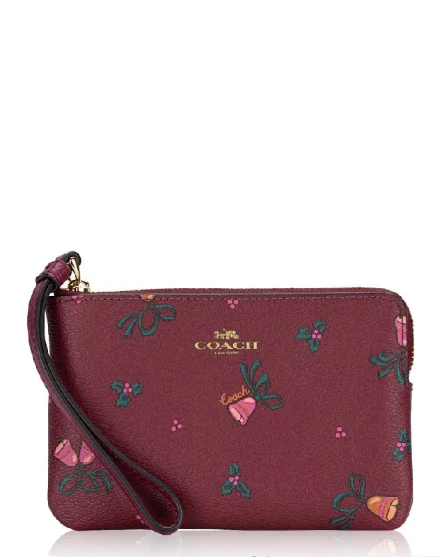 Coach tote bags with a spacious interior and multiple compartments for organizationCoach Holiday Bells Print Corner Zip Wristlet