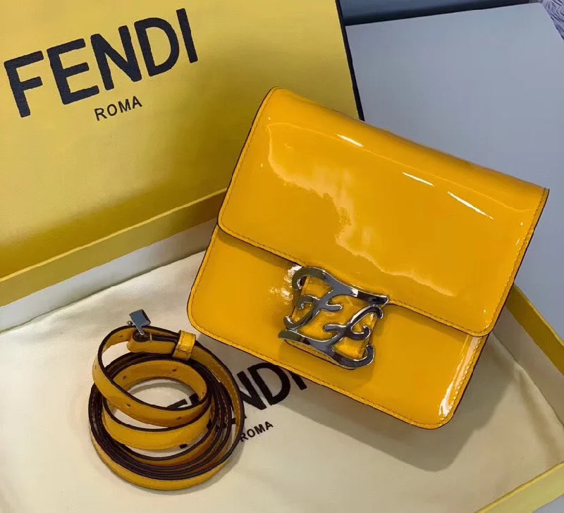 Fendi bags with a zip - top closure and a front - pocket for quick access to keys and cardsFendi Karligraphy Bag In Yellow Patent Leather