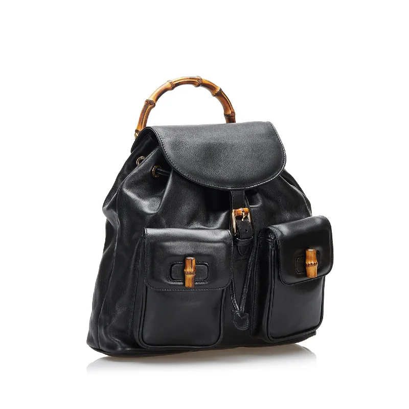 Women Gucci bags with a snap - button closure and a decorative charmGucci Bamboo Backpack (36848)