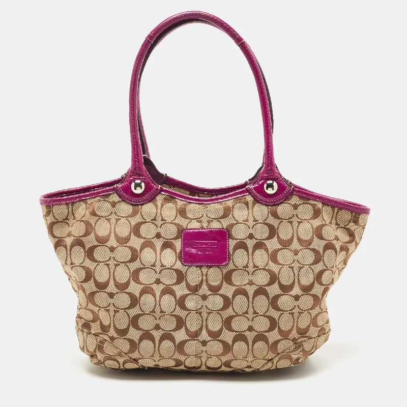 Coach Dempsey bags with a contrast - colored interior for visual interestBeige/Pink Signature Canvas and Leather Tote