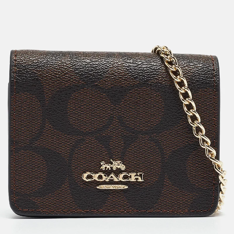 Coach tote bags with a snap - button closure and a decorative charm for styleBlack/Brown Signature Coated Canvas and Leather Mini Chain Card Case