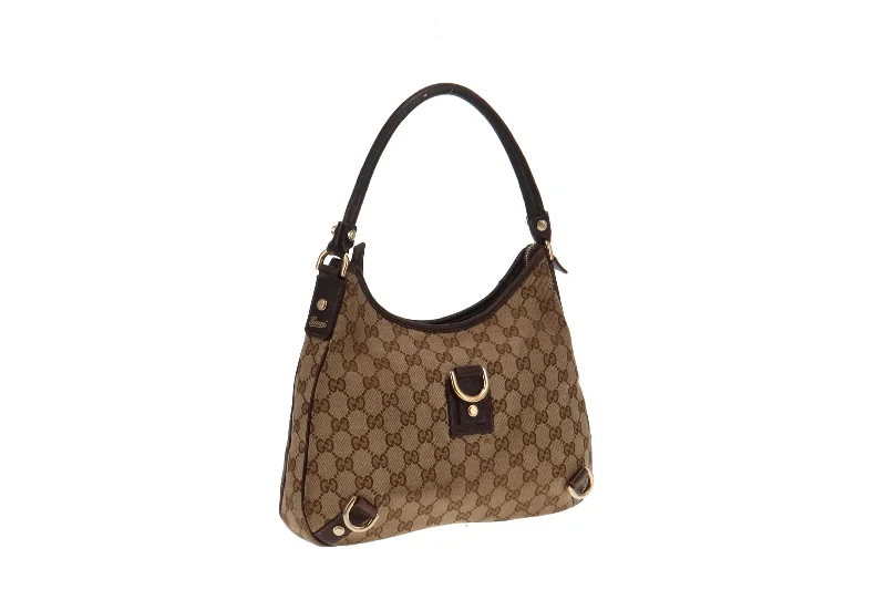 Women Gucci bags with interlocking G hardware for a classic lookGucci GG Canvas and Brown Leather Trim Abbey Shoulder Bag