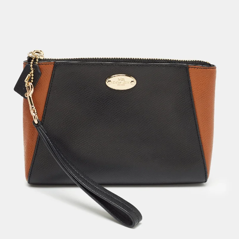 Coach Rogue bags with a monogram - embossed leather surfaceBlack/Brown Leather Morgan Wristlet Clutch