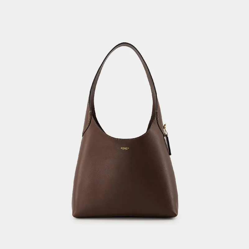 Coach handbags with a perforated leather detail for a breathable and unique designBrooklyn 28 Shoulder Bag - Coach - Leather - Maple