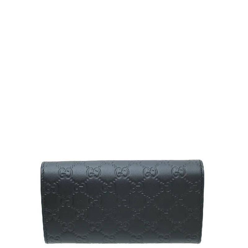 Gucci Marmont bags for women with a contrast - colored interiorGucci Black GG Guccissima Bow Continental Wallet