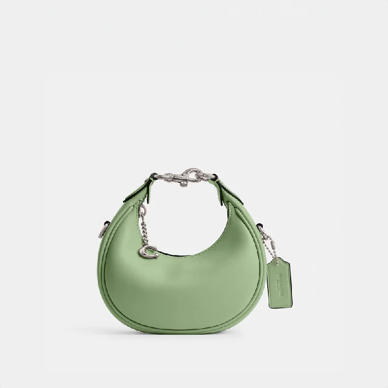 Coach bags with a zippered interior pocket for separating itemsCoach Jonnie Bag Pale Pistachio