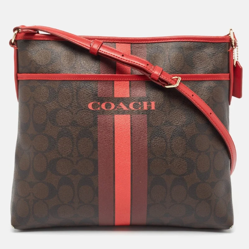 Coach Rogue bags with a monogram - embossed leather surfaceDark Brown/Red Signature Coated Canvas Varsity Striped File Crossbody Bag