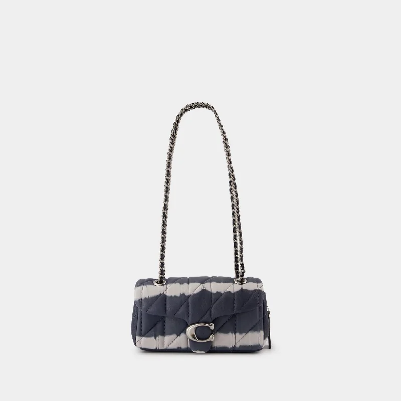 Coach Dempsey bags with a contrast - colored interior for visual interestTabby 20 Shoulder Bag - Coach - Leather - Midnight Navy