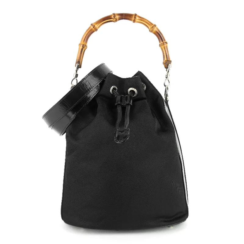 Women Gucci Sylvie bags with a crystal - embellished web stripeNylon Bamboo Handle Drawstring Bucket Bag