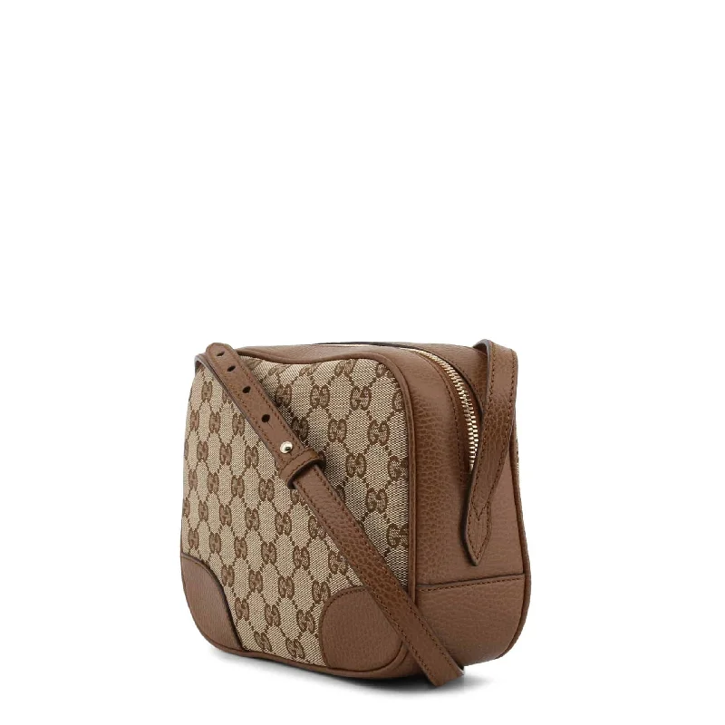 Women Gucci Sylvie bags with a monogram - embossed leatherGucci Crossbody Bags