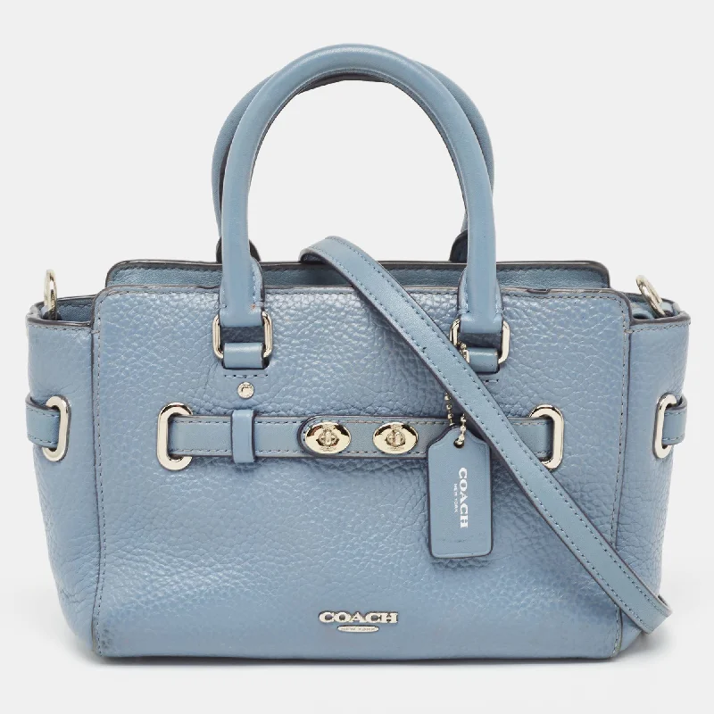 Coach Dempsey bags with a contrast - colored interior for visual interestBlue Leather Swagger 20 Tote