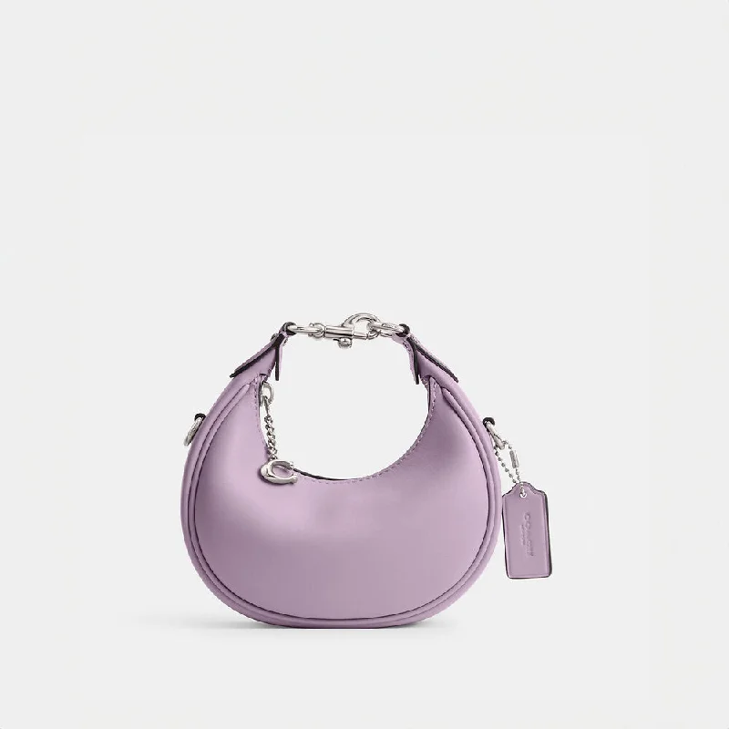 Coach tote bags with a snap - button closure and a decorative charm for styleCoach Jonnie Bag Soft Purple