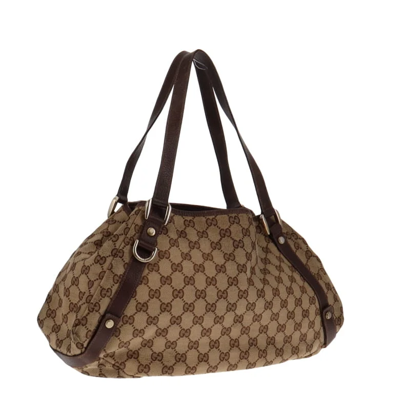 Women Gucci Sylvie bags with a monogram - embossed leatherGucci Abbey GG Hobo With Brown Leather Trims