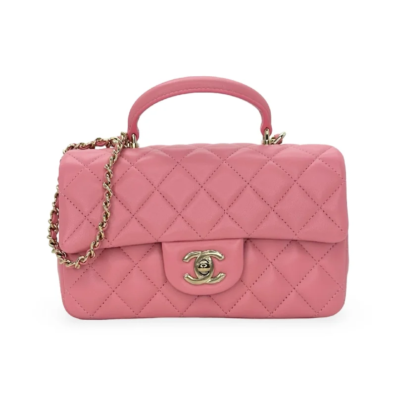 Chanel bags with iconic gold chainsCHANEL: Quilted Lambskin Mini Top Handle Flap Bag