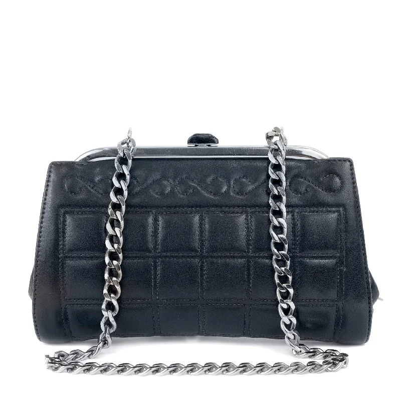 Chanel bags with exclusive seasonal releasesChanel Navy Mademoiselle Stitch Kiss Lock Clutch