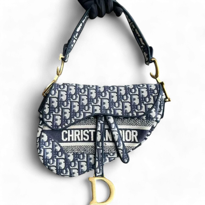 Christian Dior bags with a quilted pattern and gold - toned hardwareSaddle Medium Oblique Canvas Monogram Dark Blue Golden Hardware