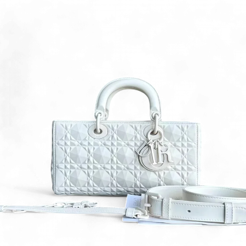 Christian Dior backpacks with a sleek, minimalist silhouetteDior D-Joy Medium Latte Cannage Calfskin Dimond Motif White